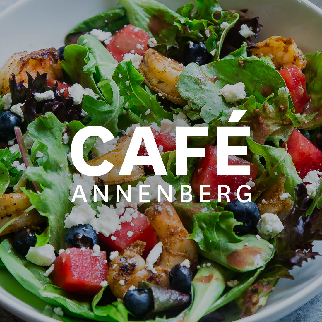 Cafe Annenberg logo over delicious food