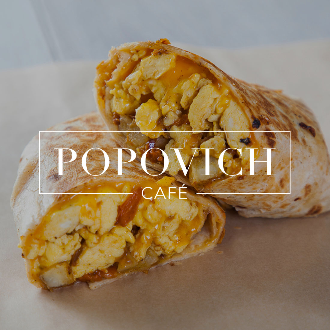 Popovich logo over delicoius breakfast burrito